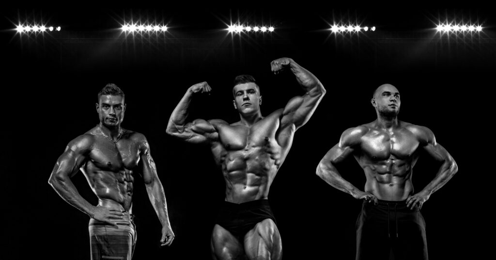 Sports Power athletic guy bodybuilder. Sportsman bodybuilder on black background with copy space. Sport concept.